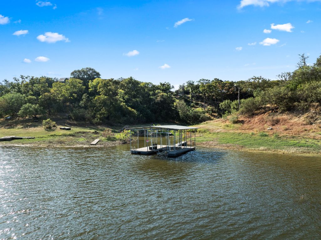 2201 Improver Road Spicewood, TX 78669 - Photo 2 of 26 a view of a lake with houses