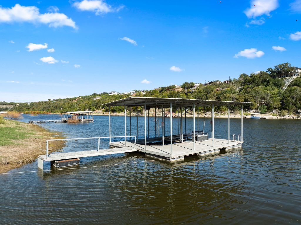 2201 Improver Road Spicewood, TX 78669 - Photo 24 of 26 a view of a lake with a mountain view