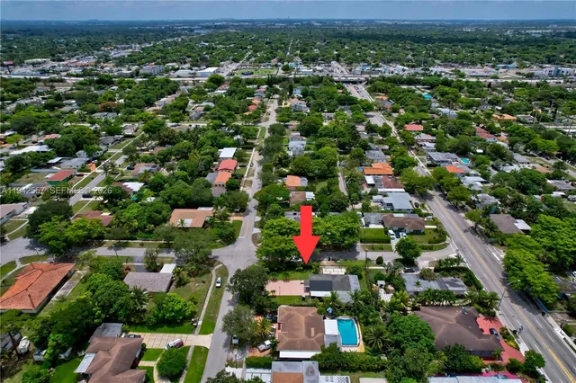 a hallway with a dining table and chairs
