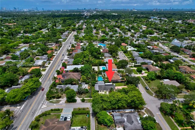 a bedroom with a bed and a lamp