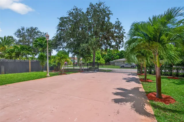 a living room with furniture a chandelier and a window