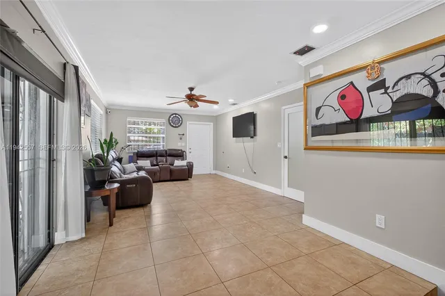 a living room with furniture and a gate