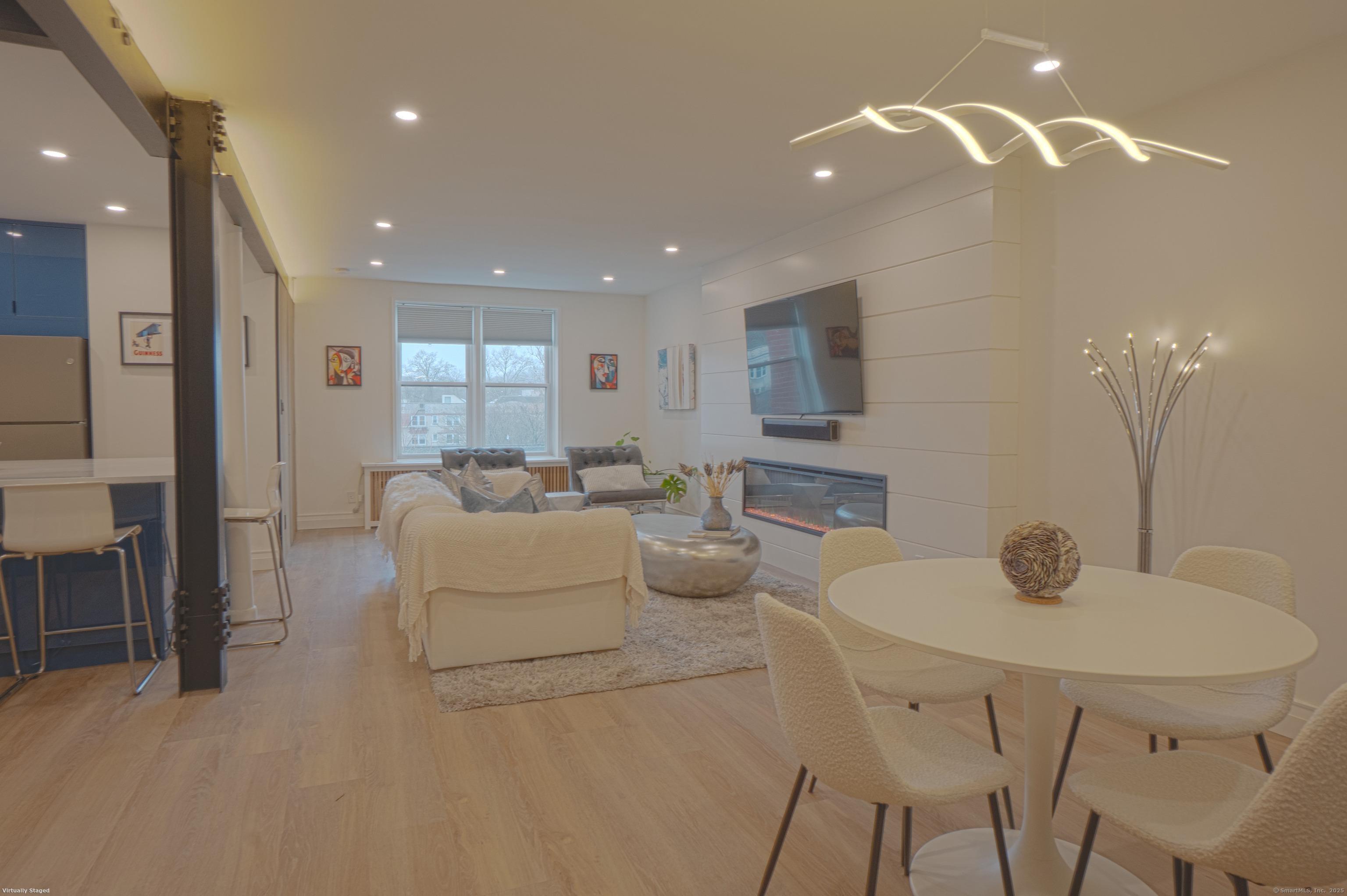 7 4th Street, Unit 4F Stamford, CT 06905 - Photo 19 of 19 Open floor plan of dining area and living room.