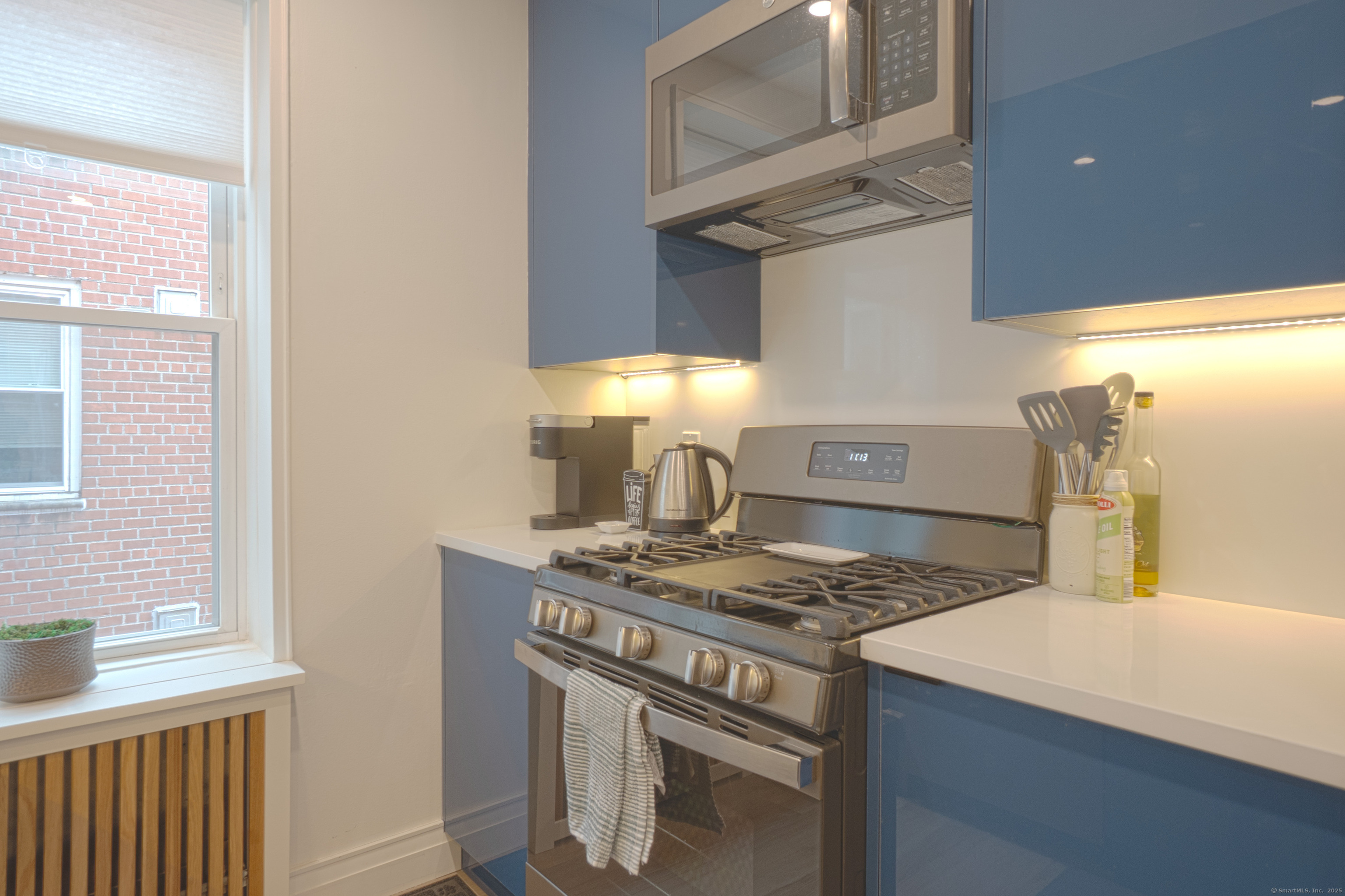 7 4th Street, Unit 4F Stamford, CT 06905 - Photo 11 of 19 Quartz countertops, stainless steel range/oven and microwave.