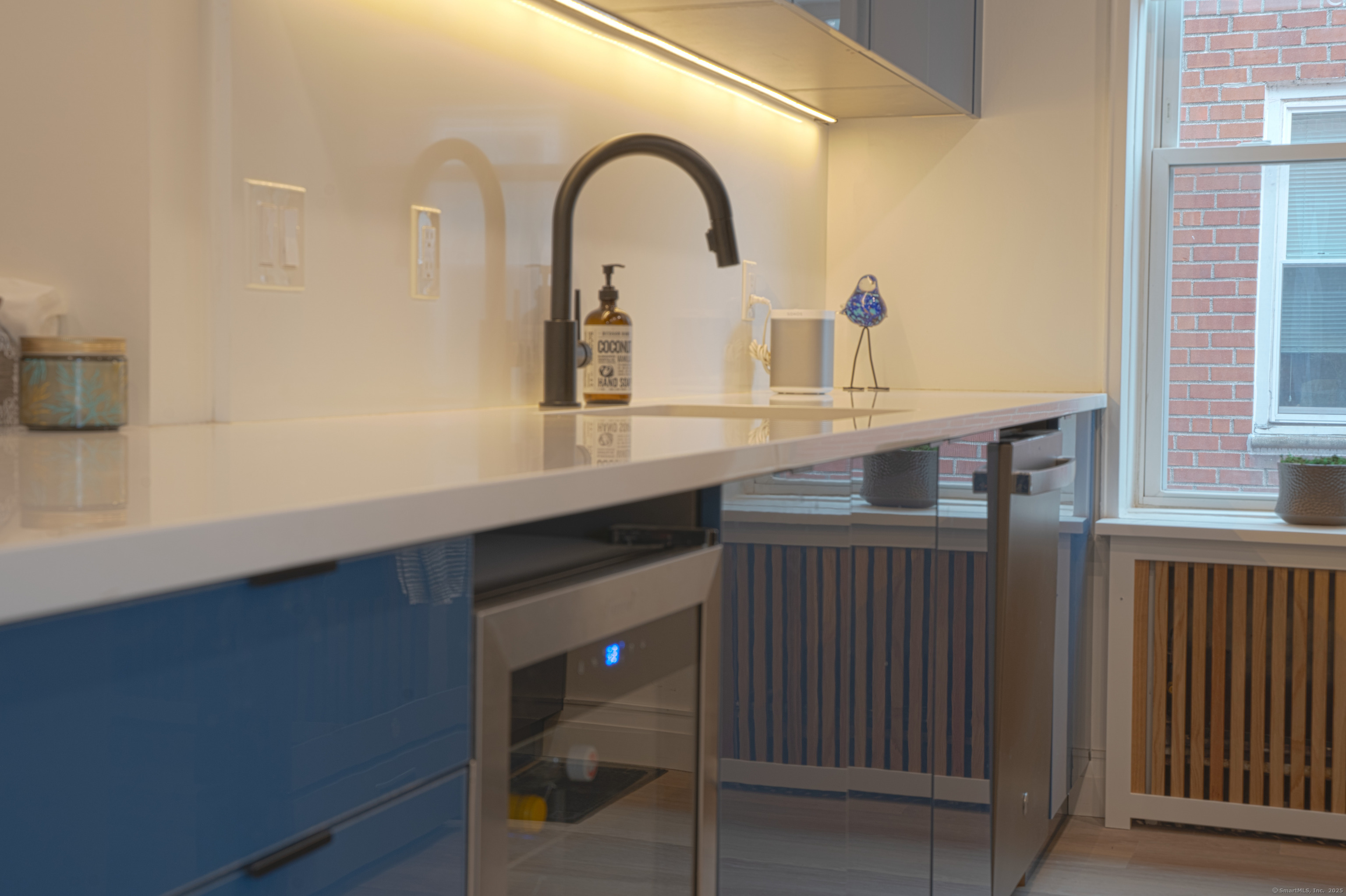 7 4th Street, Unit 4F Stamford, CT 06905 - Photo 12 of 19 Quartz countertops and wine chiller.