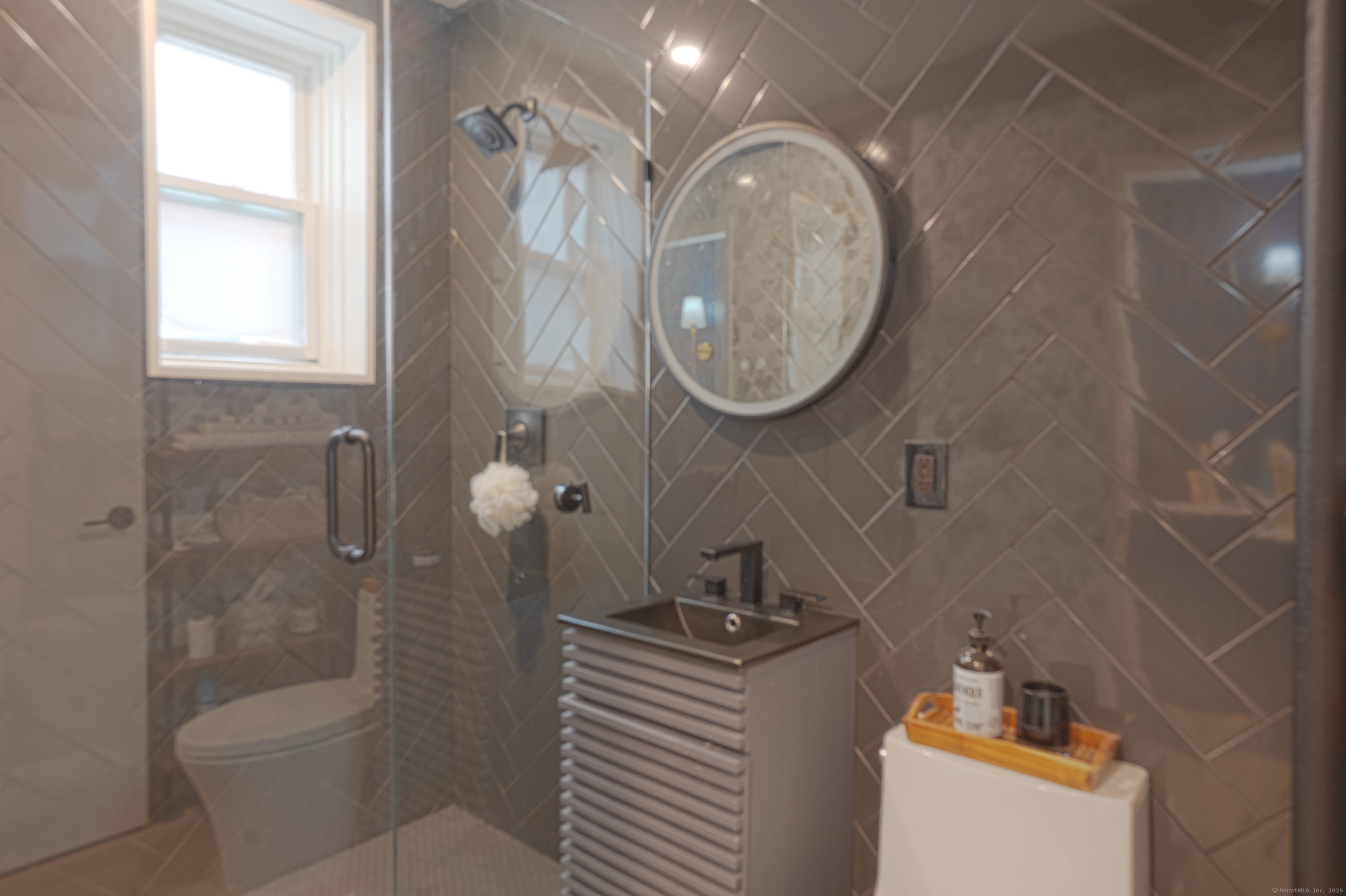 7 4th Street, Unit 4F Stamford, CT 06905 - Photo 18 of 19 Tastefully updated bathroom with shower.