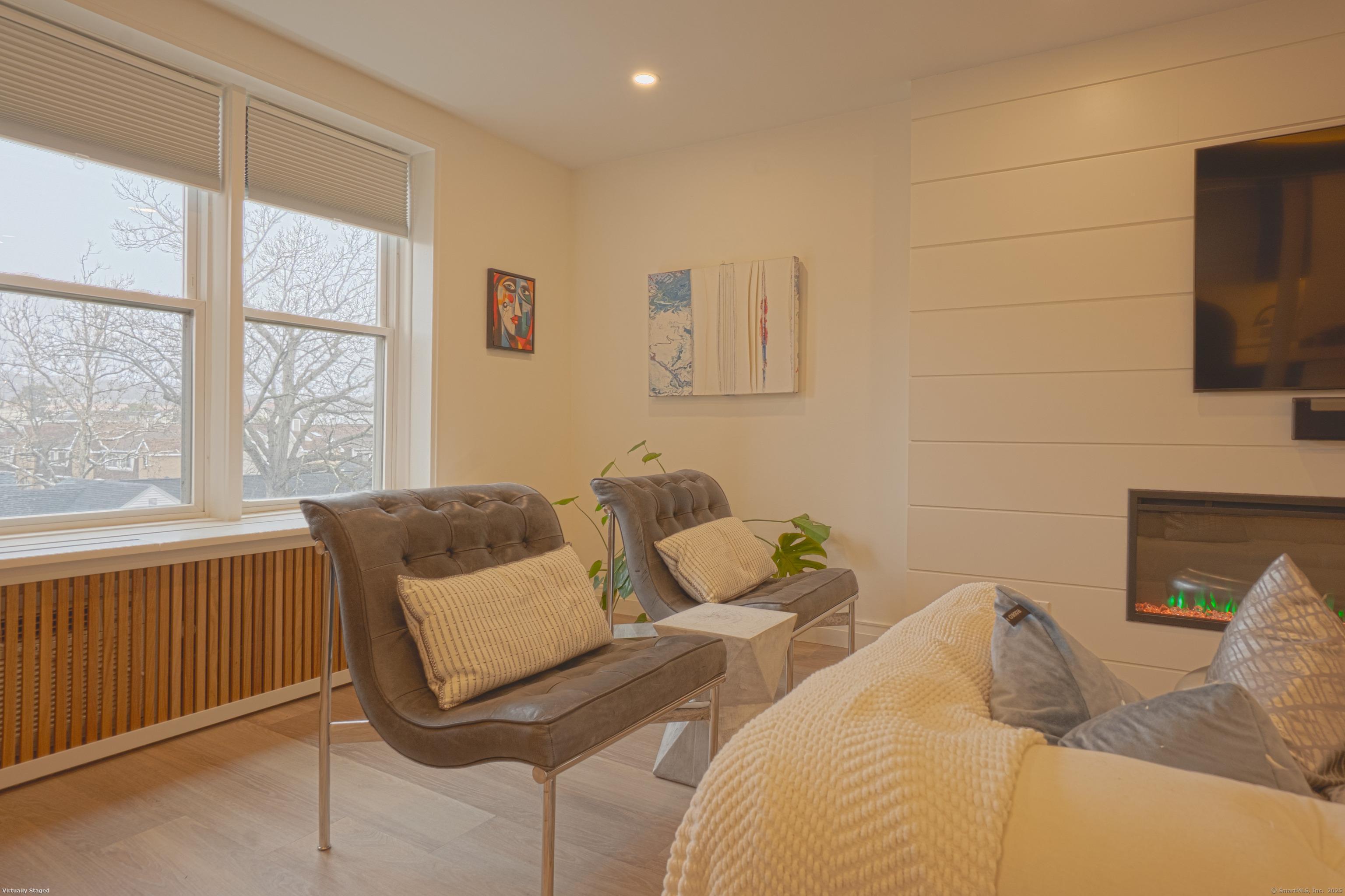 7 4th Street, Unit 4F Stamford, CT 06905 - Photo 7 of 19 Side view of living room from guest bedroom doorway.