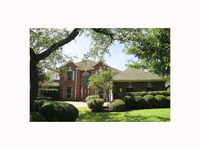 10425 Indigo Broom Loop Austin, TX 78733 - Photo 1 of 1 a view of a house with a garden