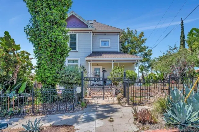 a front view of a house with a porch