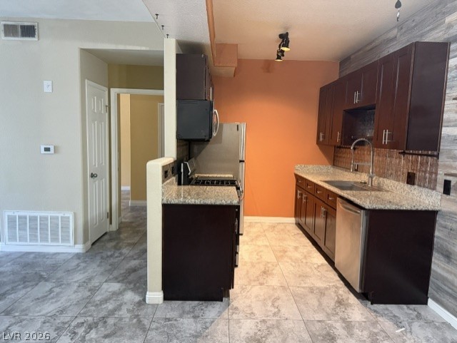 3318 North Decatur Boulevard, Unit 1163 Las Vegas, NV 89130 - Photo 16 of 35 Functional kitchen with ample cabinet space, granite countertops, and modern appliances.