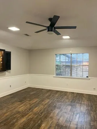 a view of room with wooden floor