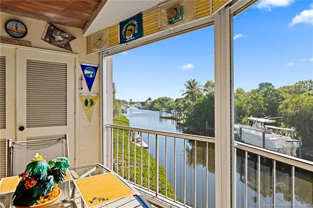 a view of a balcony with chairs