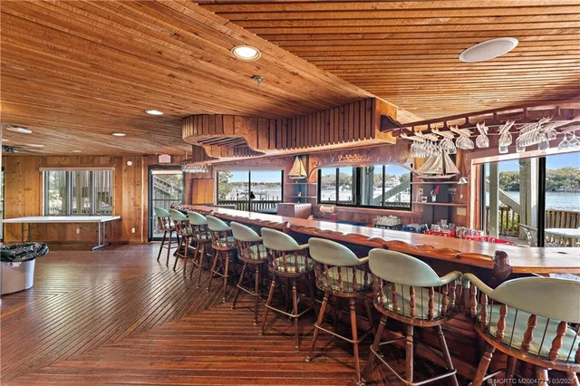 a dining space with furniture and wooden floor