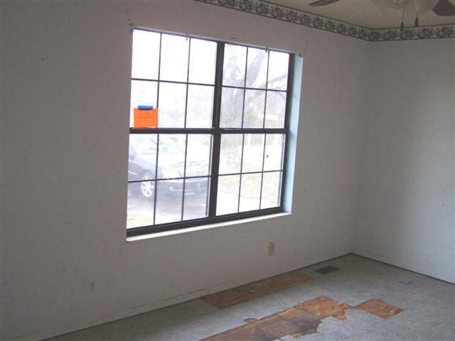 2619 South Main Street Springfield, TN 37172 - Photo 3 of 11 Living room has two coat closets & two double hung windows. It connects directly to the kitchen and hallway.