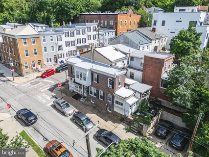 an aerial view of residential houses with outdoor space