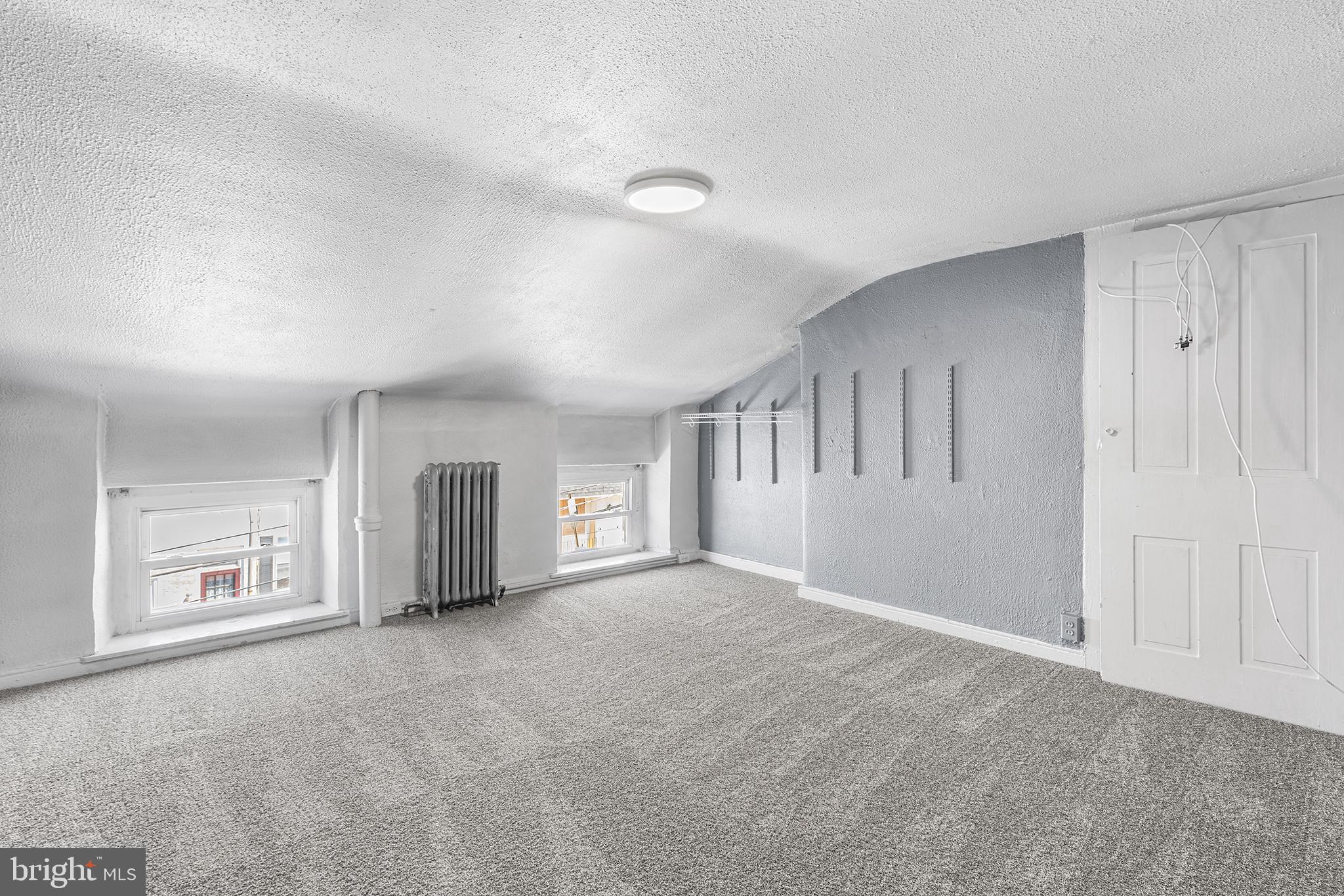 157 Cotton Street Philadelphia, PA 19127 - Photo 18 of 26 a view of an empty room with a window