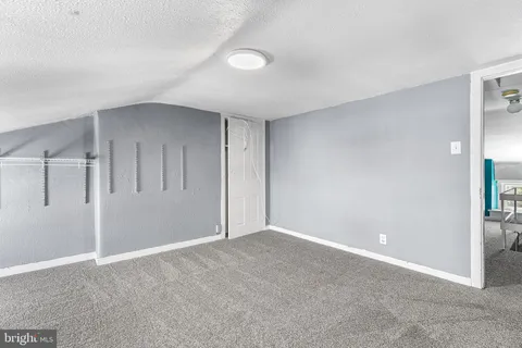 a view of entryway with a window and wooden floor