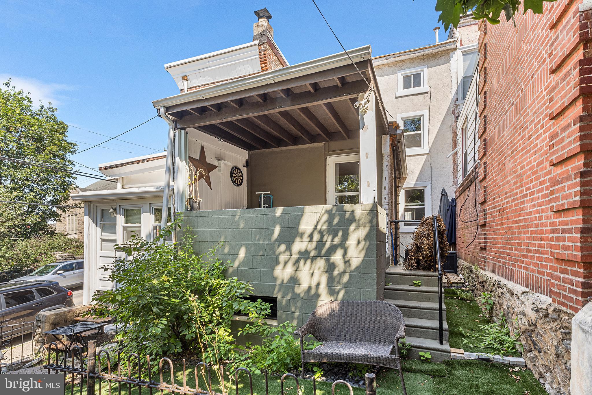 157 Cotton Street Philadelphia, PA 19127 - Photo 23 of 26 a view of a house with backyard and sitting area