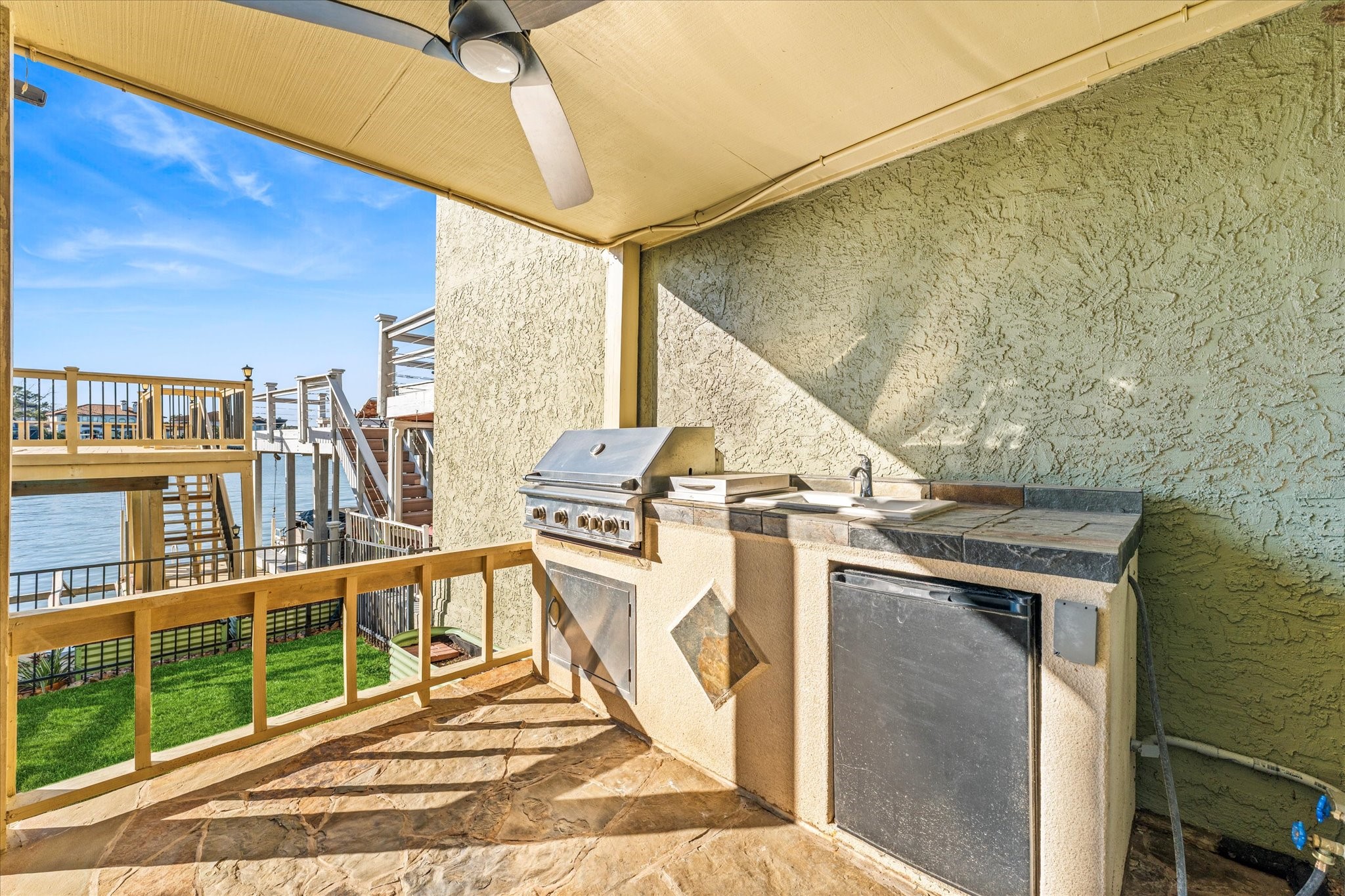 145 Capetown Way Conroe, TX 77356 - Photo 12 of 38 a view of a patio with a table and chairs