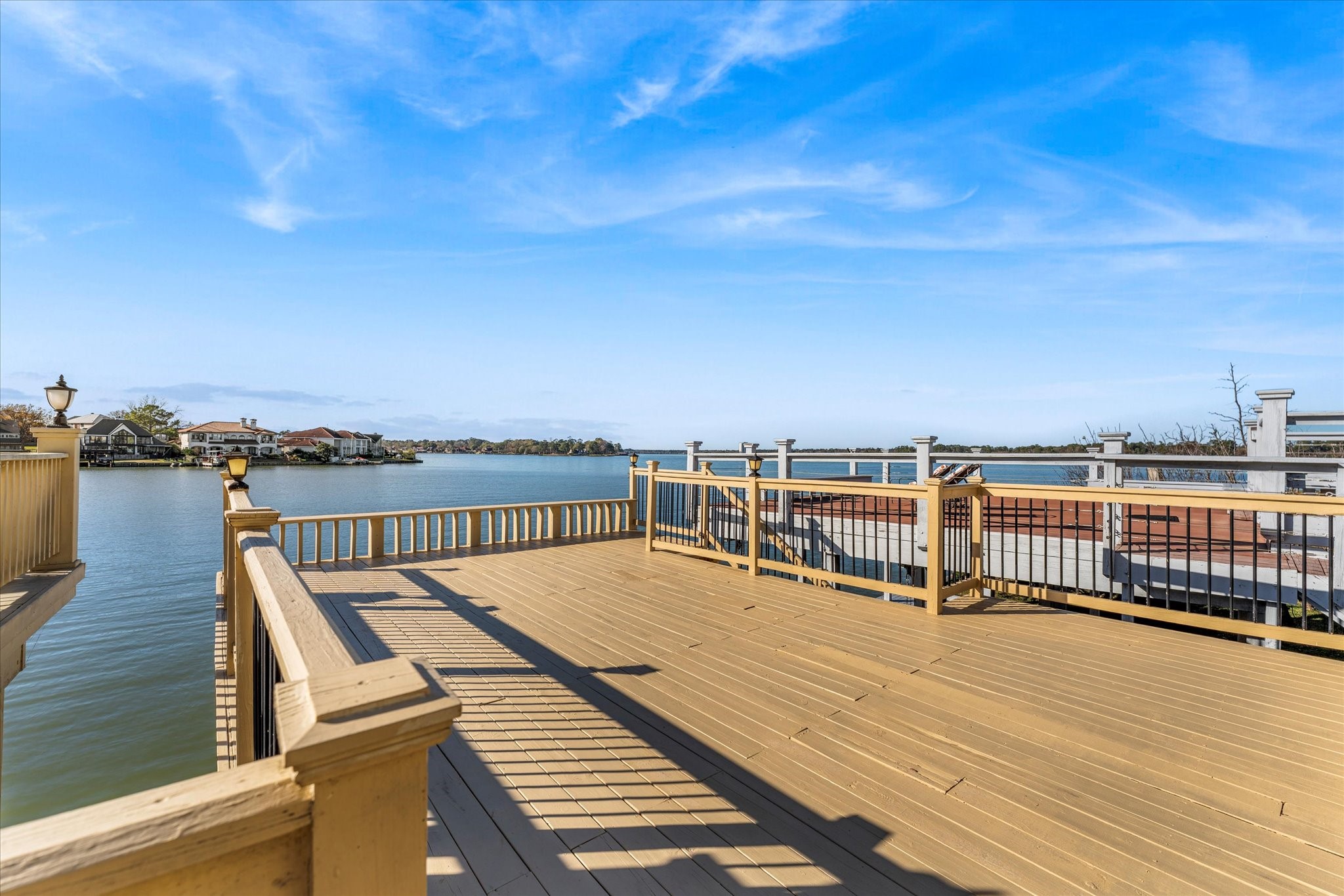 145 Capetown Way Conroe, TX 77356 - Photo 27 of 38 a view of a balcony with wooden floor and city view