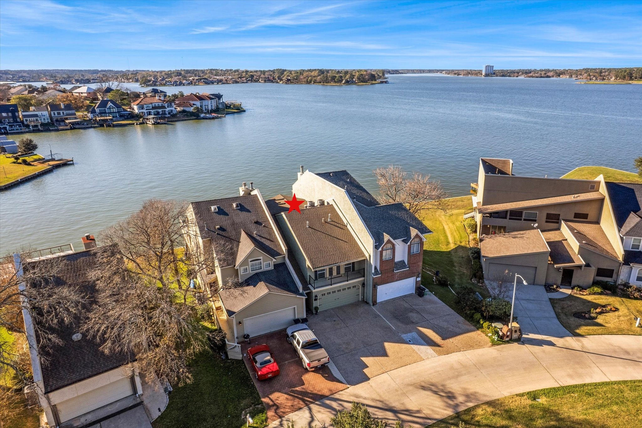 145 Capetown Way Conroe, TX 77356 - Photo 30 of 38 a view of a lake and a mountain view