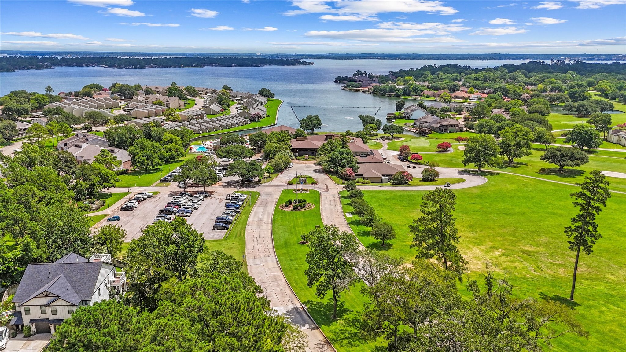 145 Capetown Way Conroe, TX 77356 - Photo 32 of 38 a view of a lake with a big yard