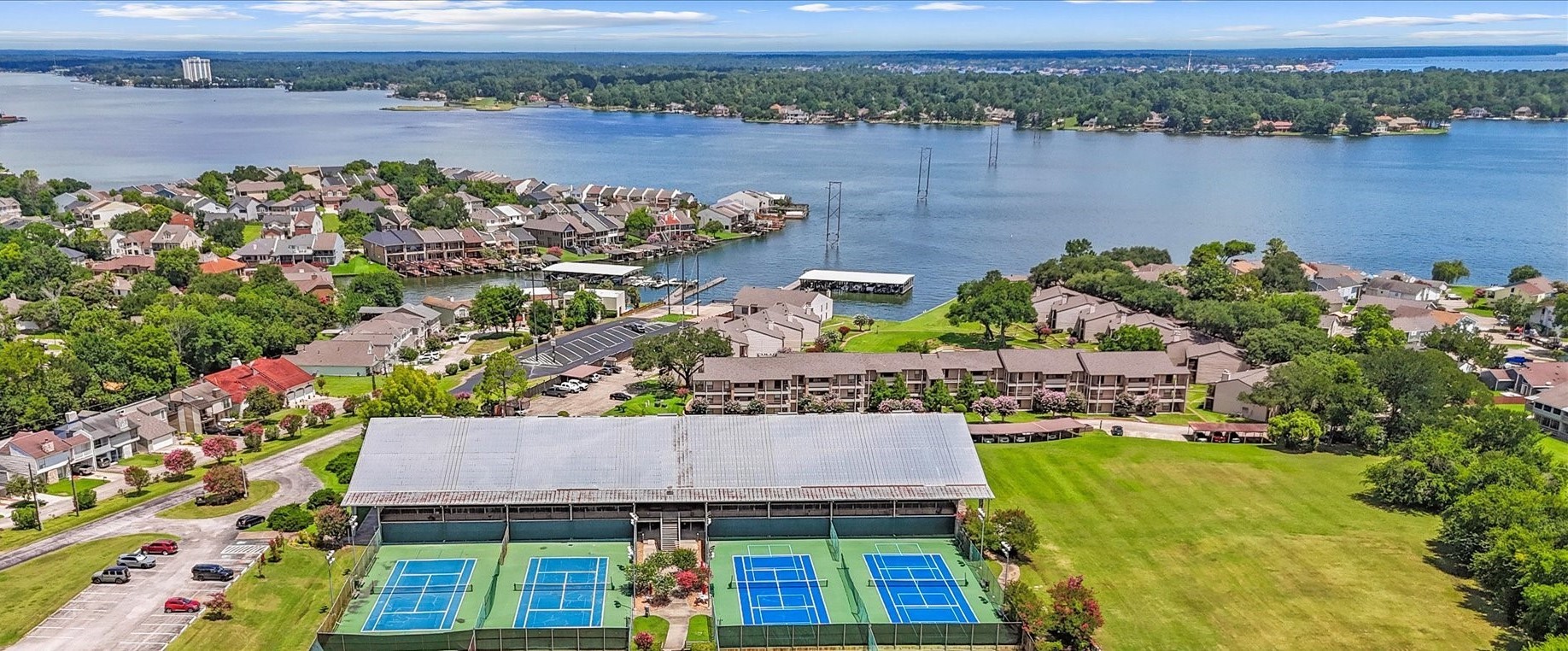 145 Capetown Way Conroe, TX 77356 - Photo 37 of 38 an aerial view of a house with a lake view