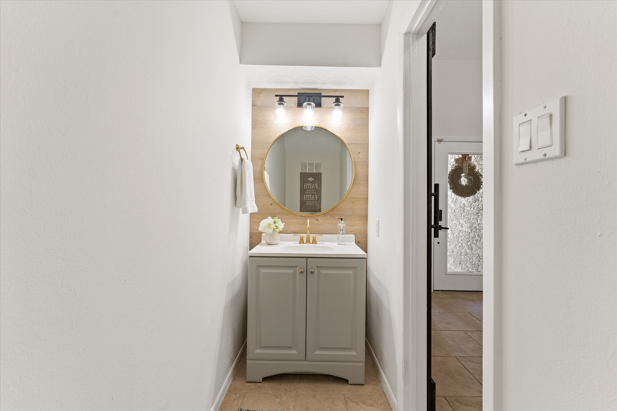 145 Capetown Way Conroe, TX 77356 - Photo 4 of 38 a bathroom with a sink and mirror