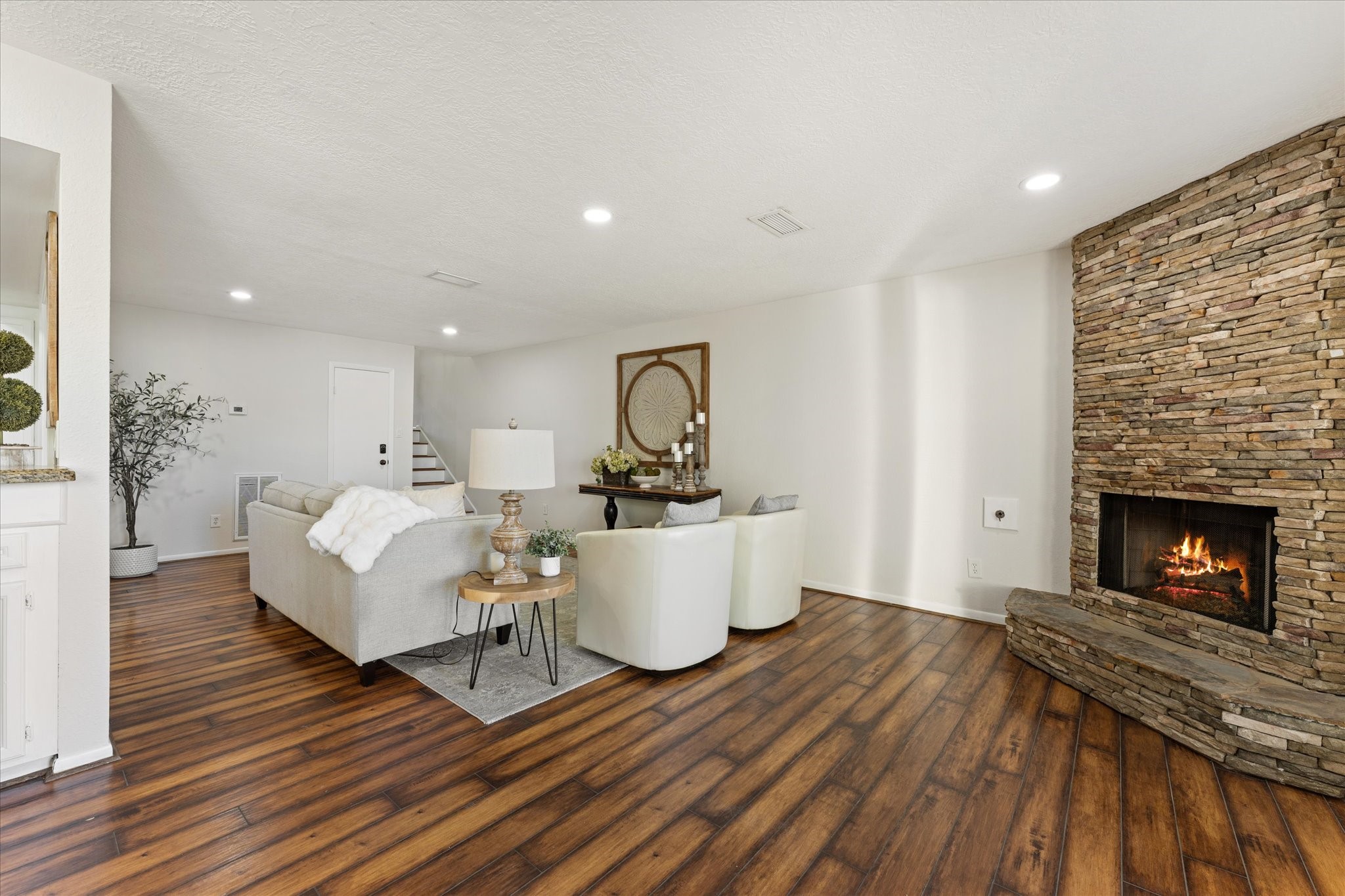 145 Capetown Way Conroe, TX 77356 - Photo 6 of 38 a living room with furniture and a fireplace