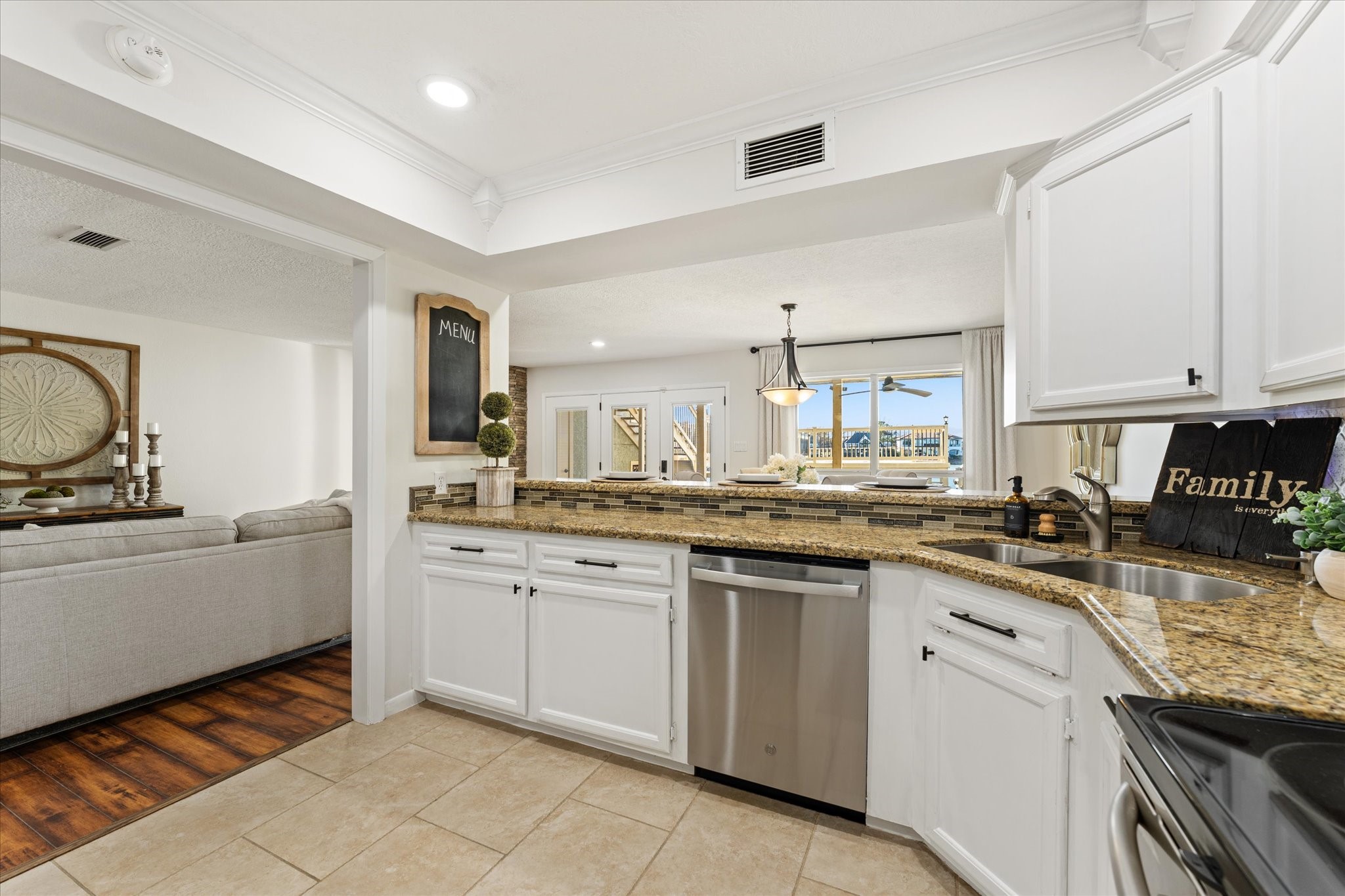 145 Capetown Way Conroe, TX 77356 - Photo 10 of 38 a kitchen with granite countertop cabinets stainless steel appliances a sink and a counter top space