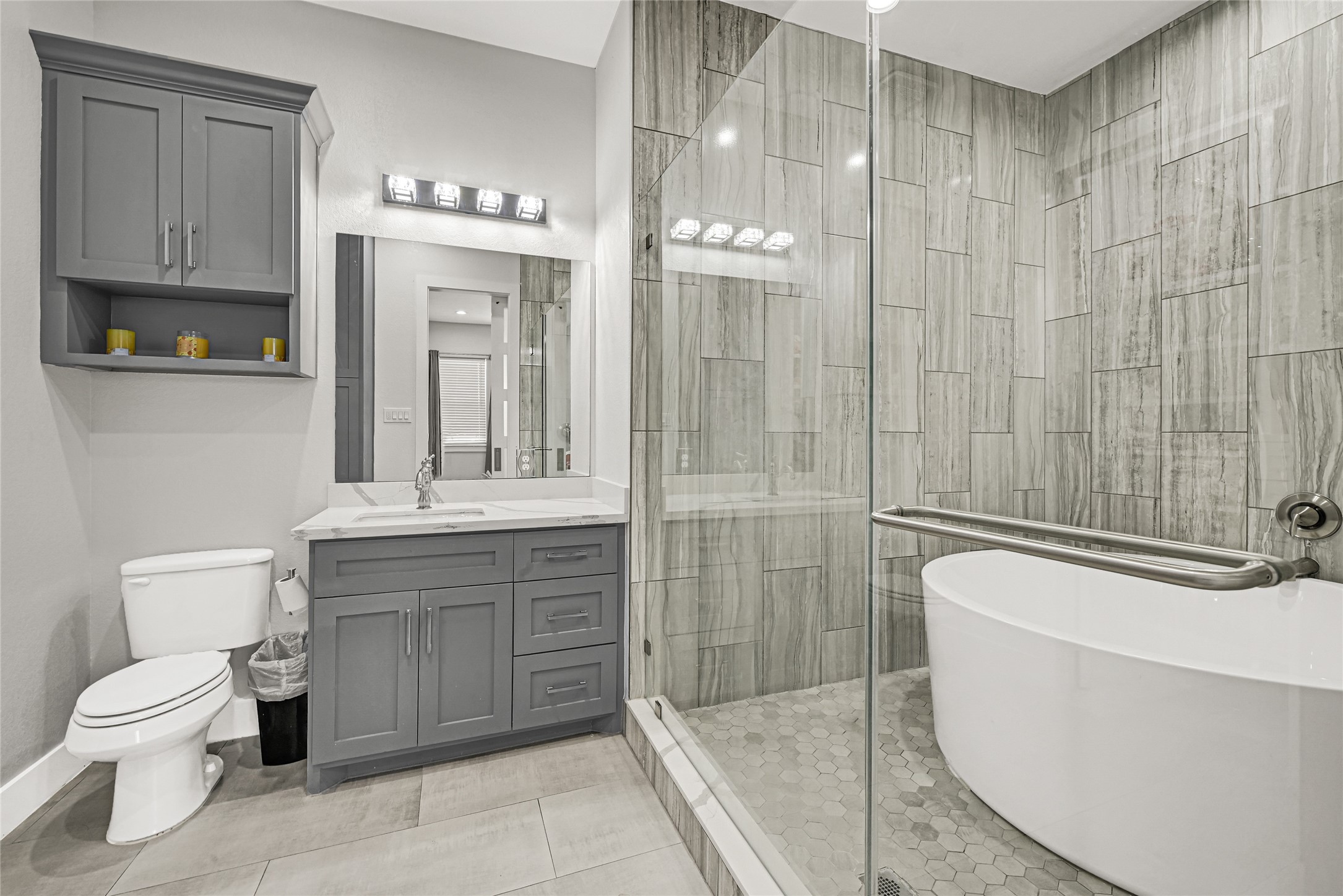 4821 1st Street Houston, TX 77504 - Photo 28 of 48 a bathroom with a toilet a sink and glass door