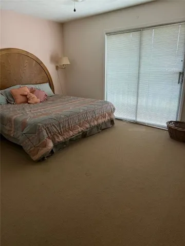 a bedroom with two beds and a window