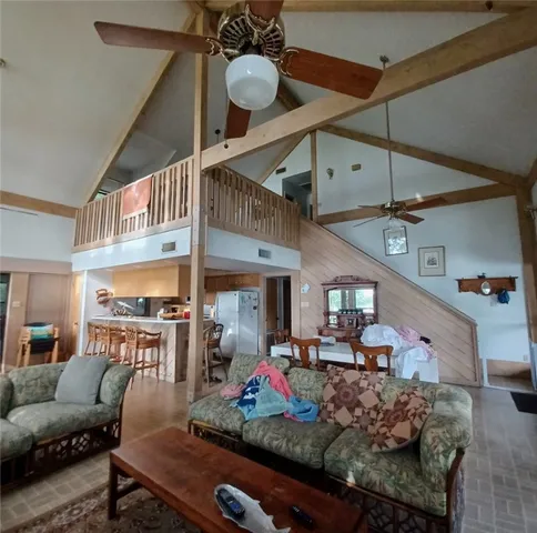 a room with lots of furniture and white walls