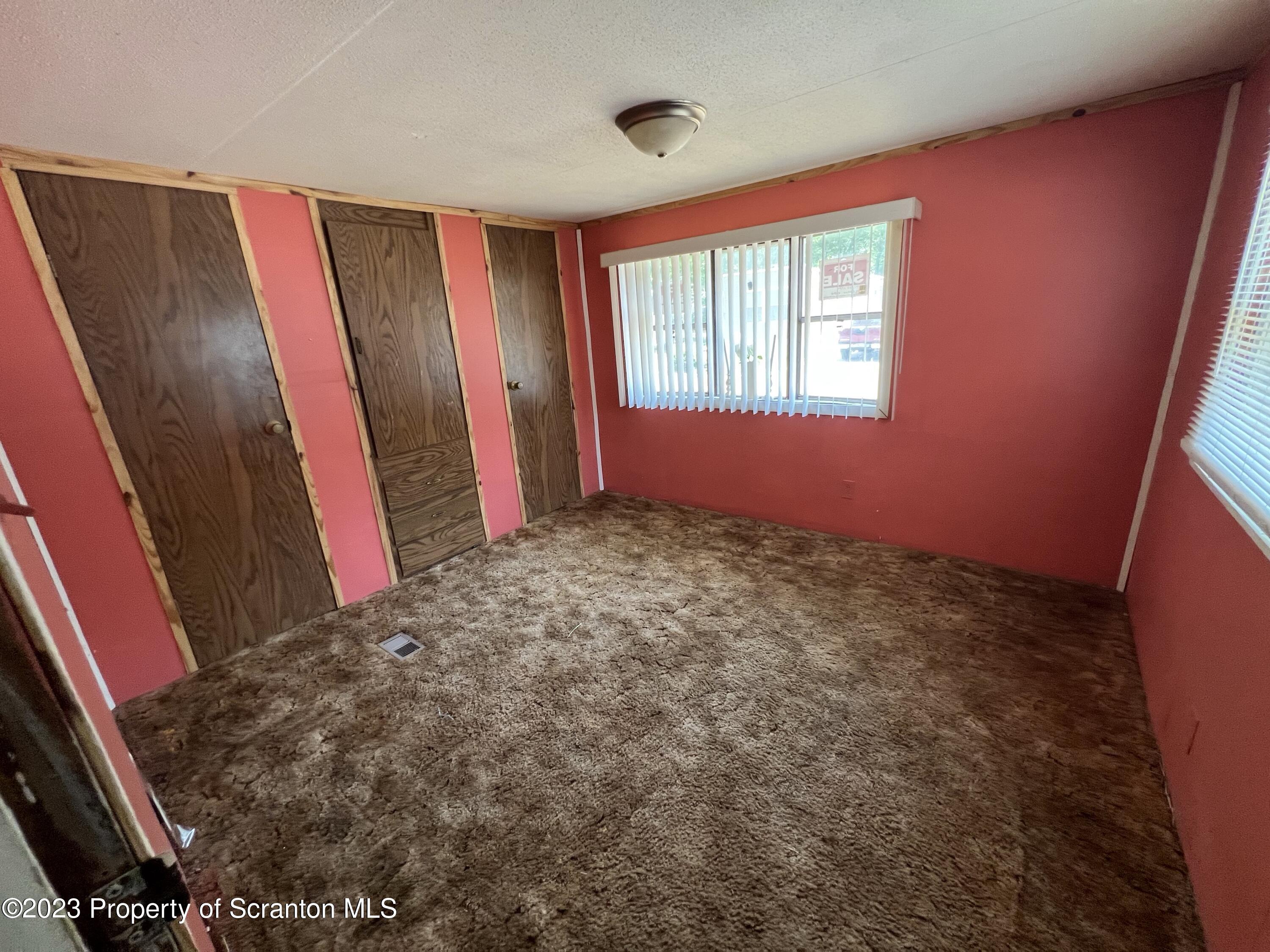 504 5th Street Avoca, PA 18641 - Photo 4 of 8 a view of an empty room with a window