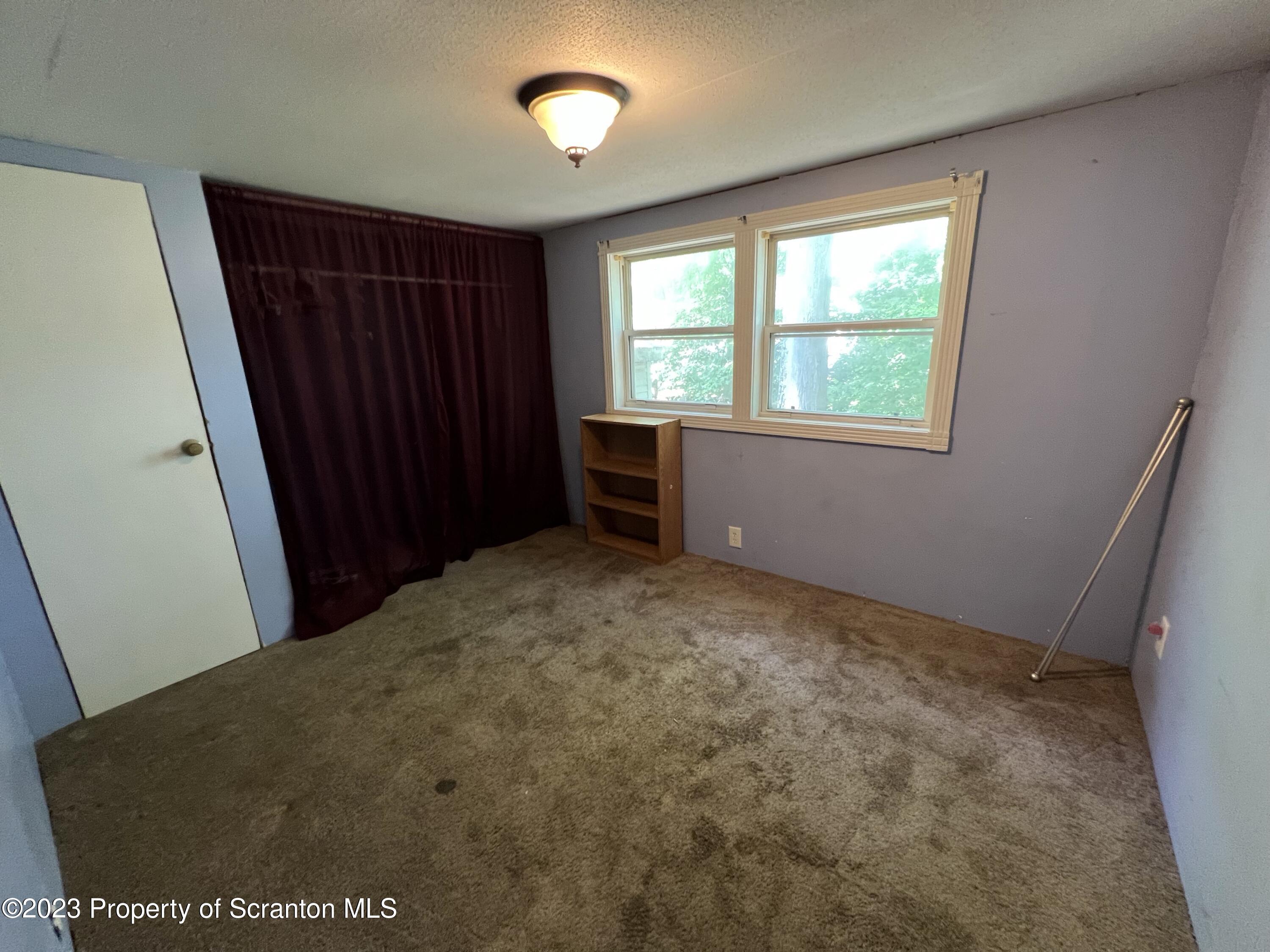 504 5th Street Avoca, PA 18641 - Photo 5 of 8 an empty room with windows