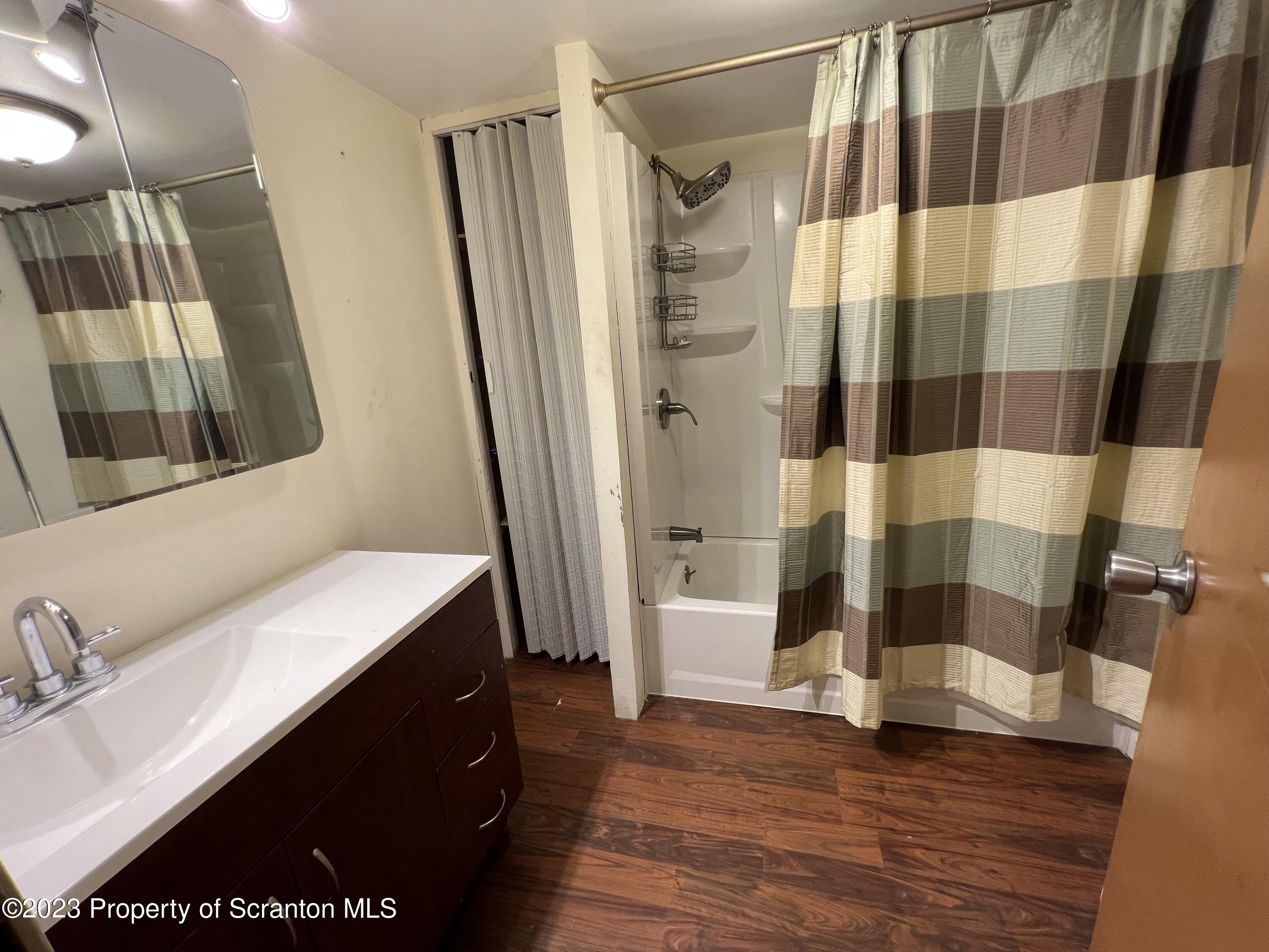 504 5th Street Avoca, PA 18641 - Photo 7 of 8 a bathroom with a sink and a mirror