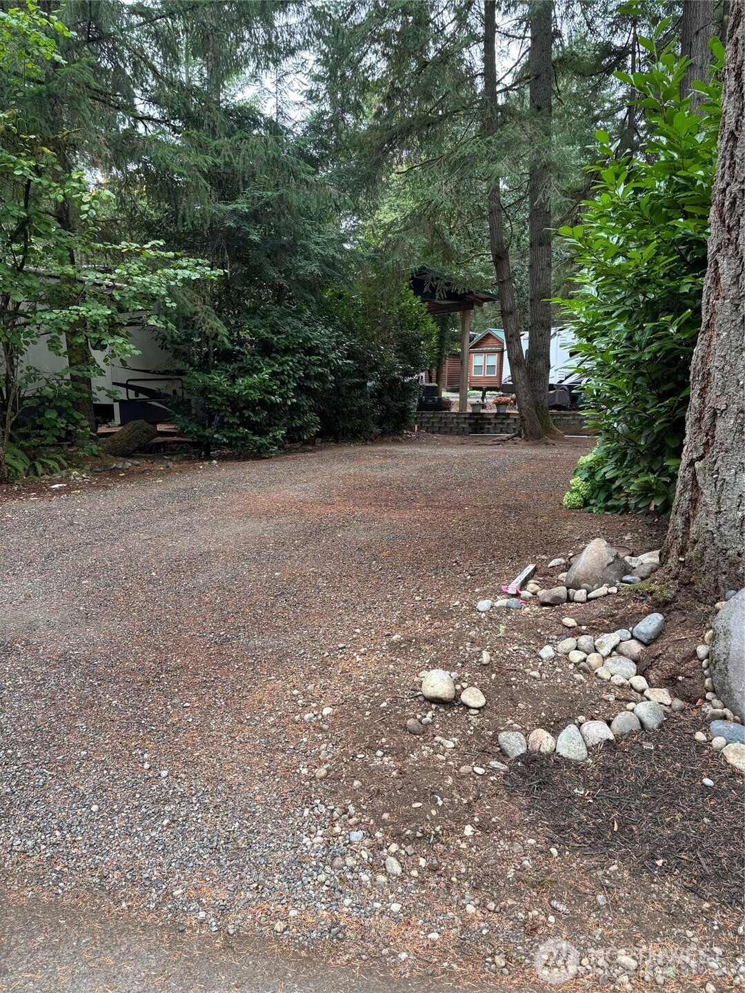 1546 Reservation Road Southeast, Unit 185 Olympia, WA 98513 - Photo 1 of 20 a view of road with trees