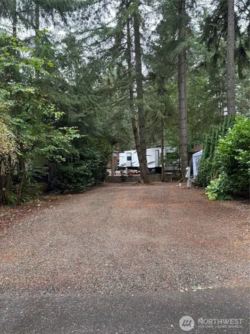 a view of outdoor space with deck and tree