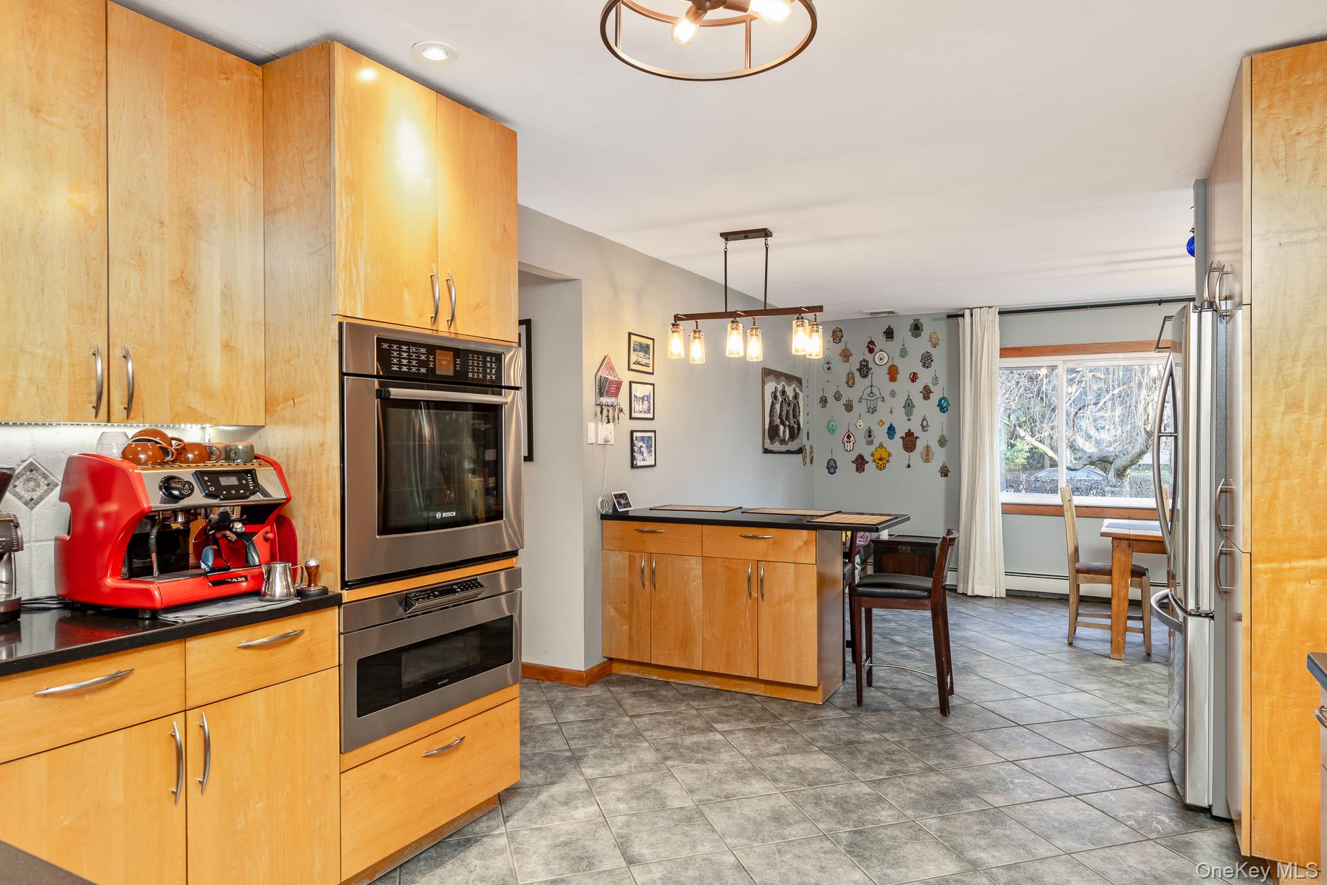 1 Cumberland Path Setauket, NY 11733 - Photo 11 of 29 a kitchen with stainless steel appliances a stove a refrigerator and cabinets