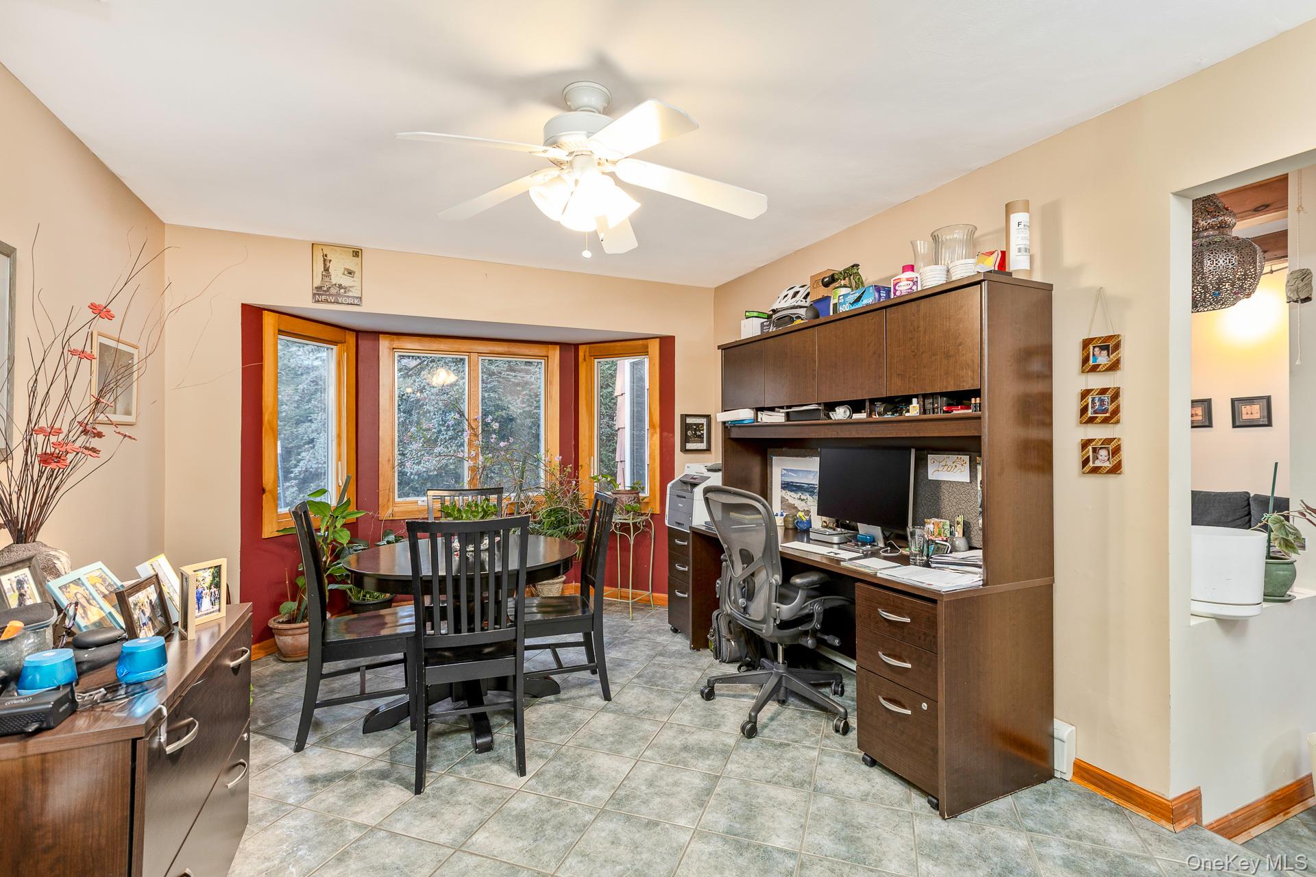 1 Cumberland Path Setauket, NY 11733 - Photo 12 of 29 a view of a workspace with furniture and a livingroom