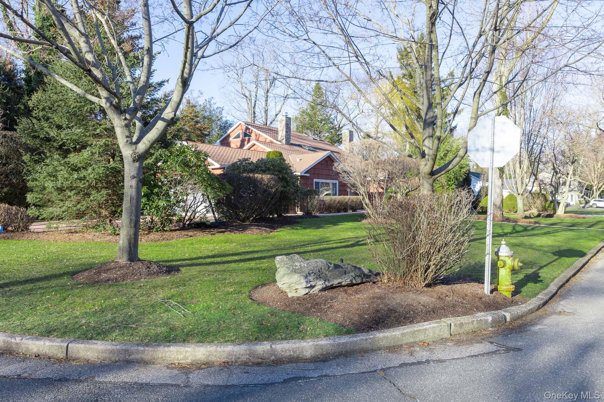 1 Cumberland Path Setauket, NY 11733 - Photo 22 of 29 a view of a park with large trees