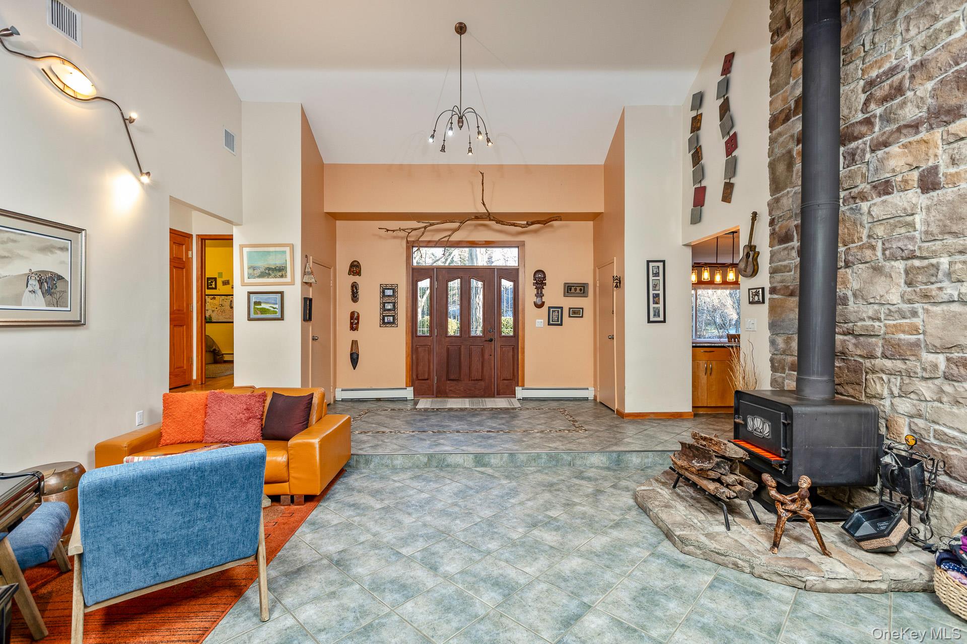 1 Cumberland Path Setauket, NY 11733 - Photo 9 of 29 a living room with furniture a dining table and chairs