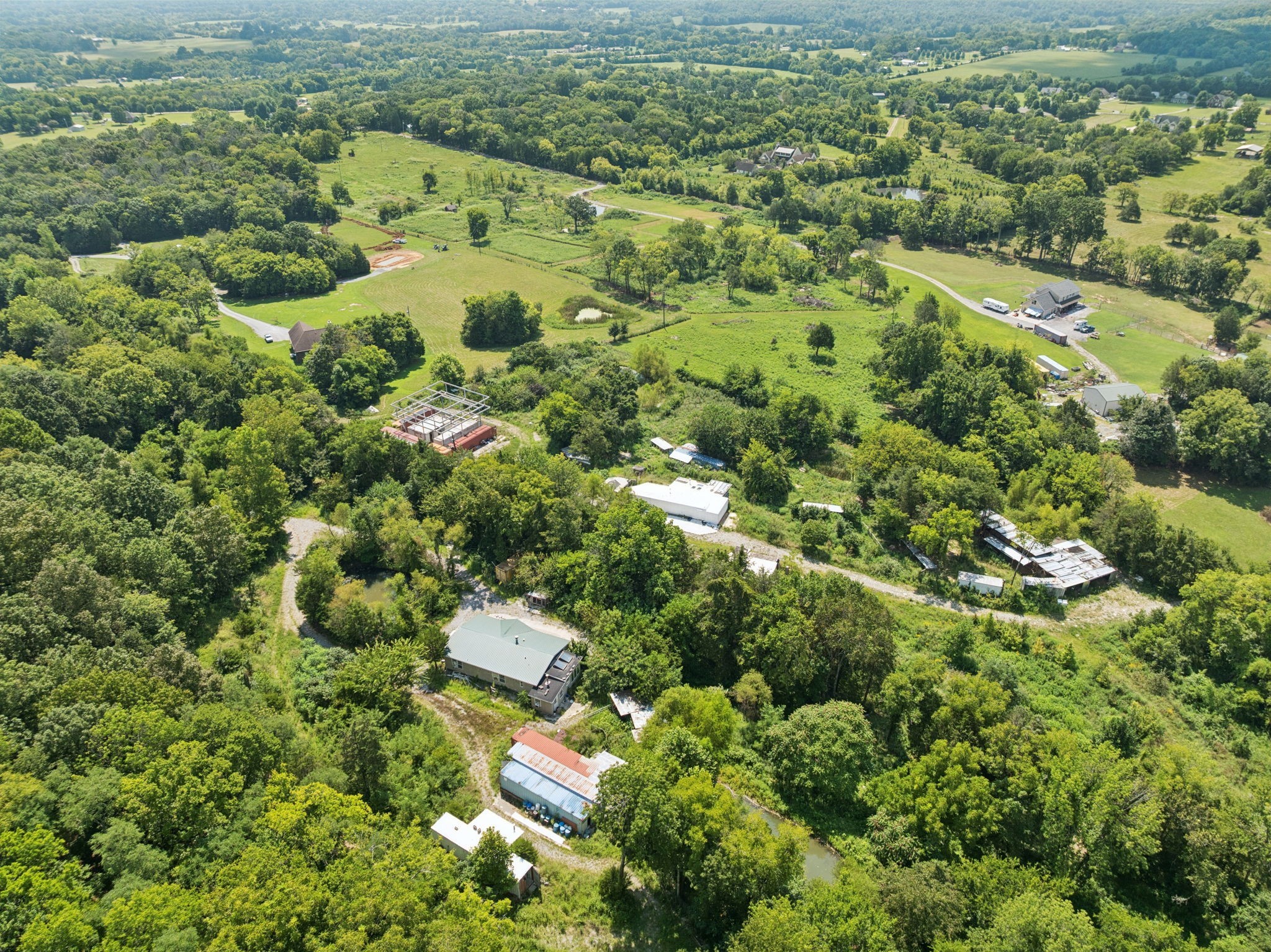 576 Nokes Road Lebanon, TN 37090 - Photo 4 of 11 an aerial view of residential houses with outdoor space and trees