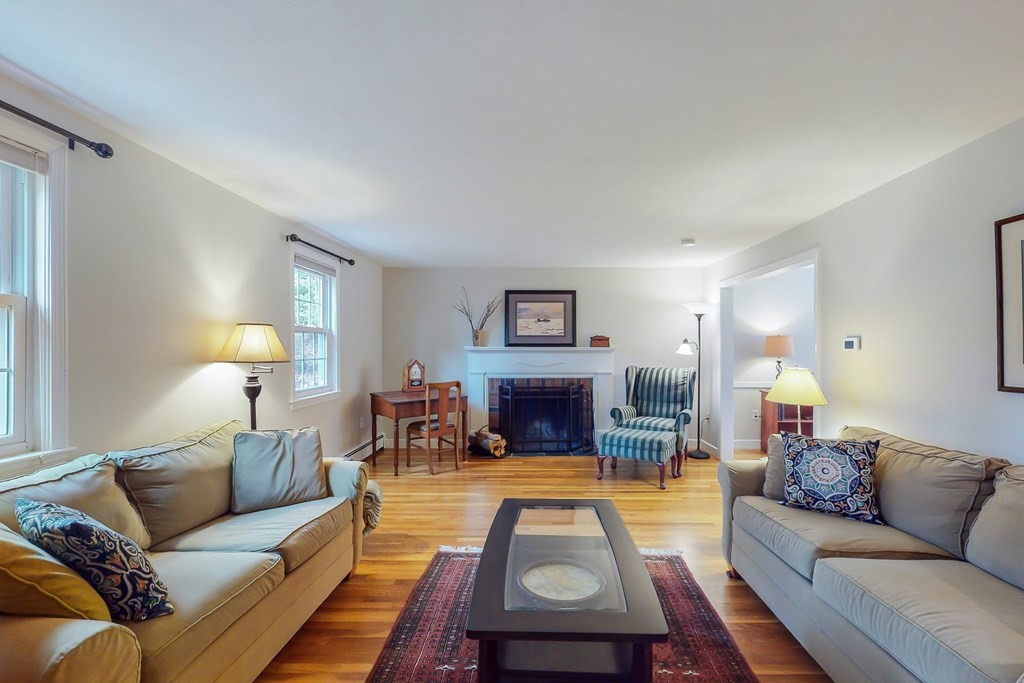 8 Meadowview Road Wayland, MA 01778 - Photo 11 of 40 a living room with furniture and a fireplace