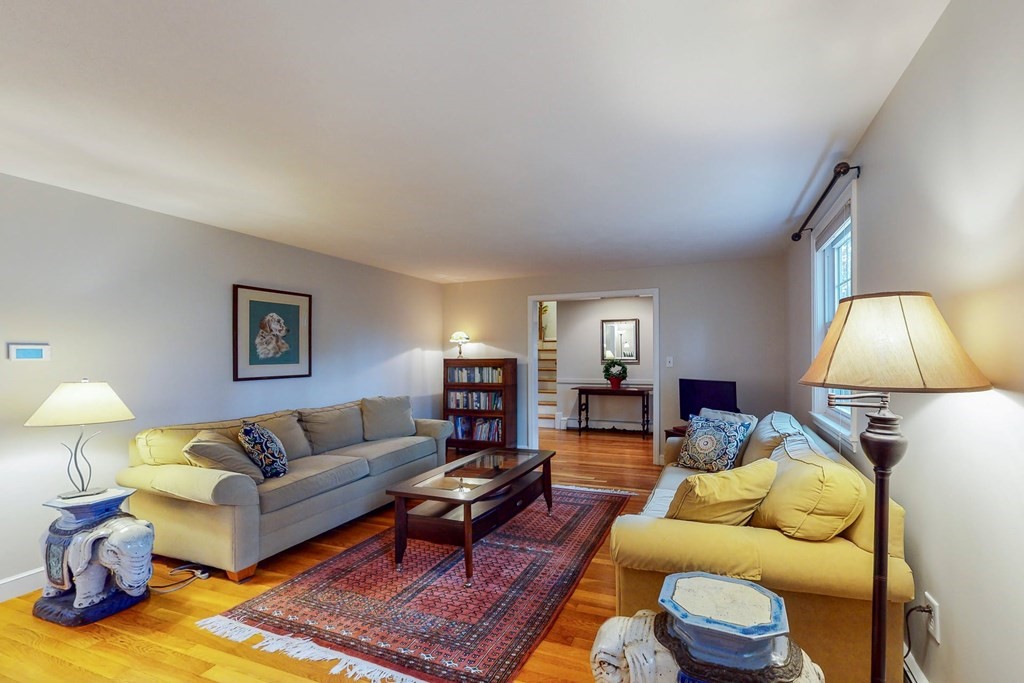 8 Meadowview Road Wayland, MA 01778 - Photo 13 of 40 a living room with furniture and a lamp