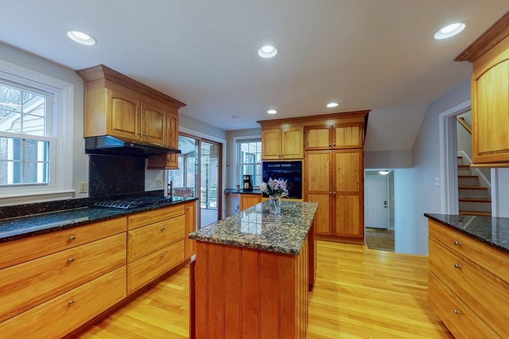 8 Meadowview Road Wayland, MA 01778 - Photo 16 of 40 a kitchen with stainless steel appliances granite countertop a sink and a refrigerator