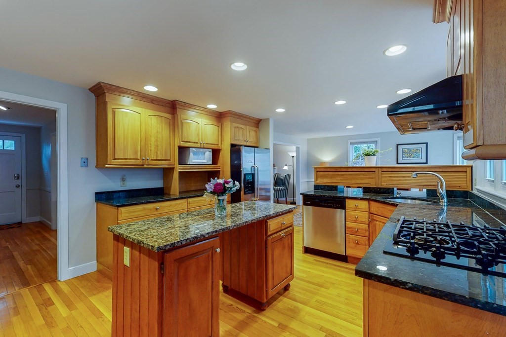 8 Meadowview Road Wayland, MA 01778 - Photo 17 of 40 a kitchen with stainless steel appliances granite countertop sink stove and cabinets