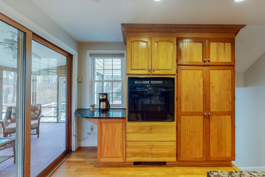 8 Meadowview Road Wayland, MA 01778 - Photo 19 of 40 a kitchen with stainless steel appliances granite countertop a refrigerator and a sink