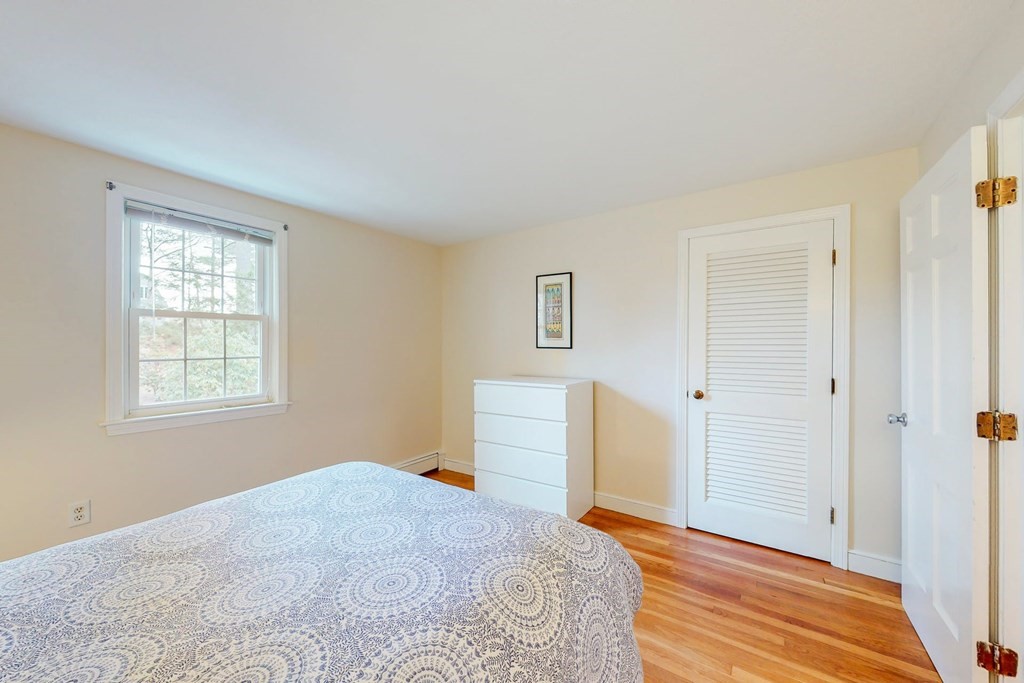 8 Meadowview Road Wayland, MA 01778 - Photo 25 of 40 a bedroom with a bed and a window