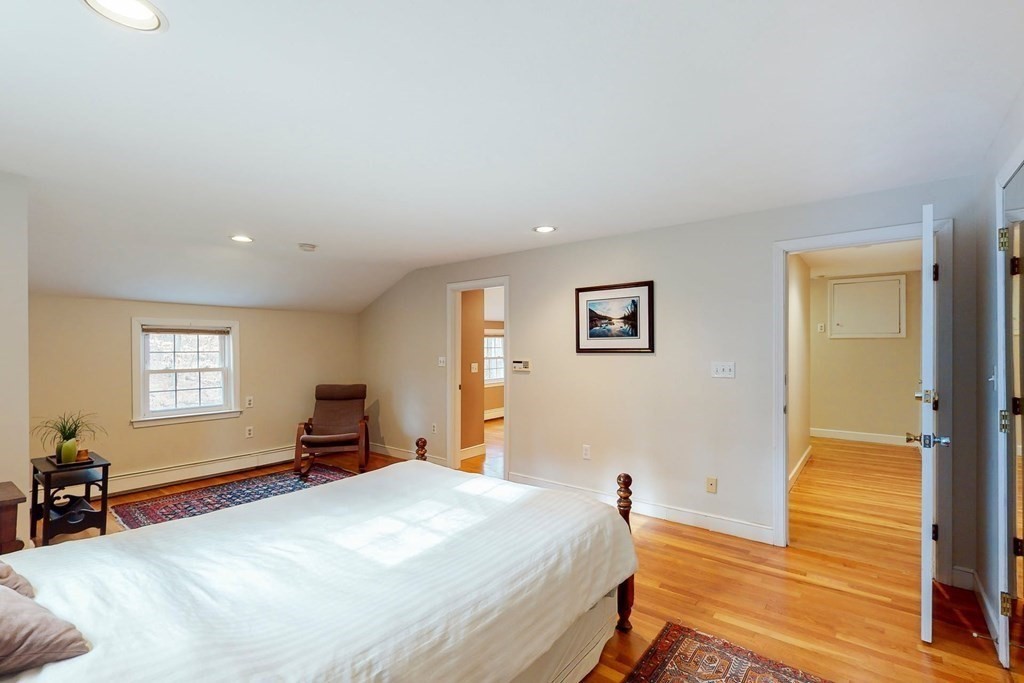 8 Meadowview Road Wayland, MA 01778 - Photo 34 of 40 a bedroom with a bed and wooden floor